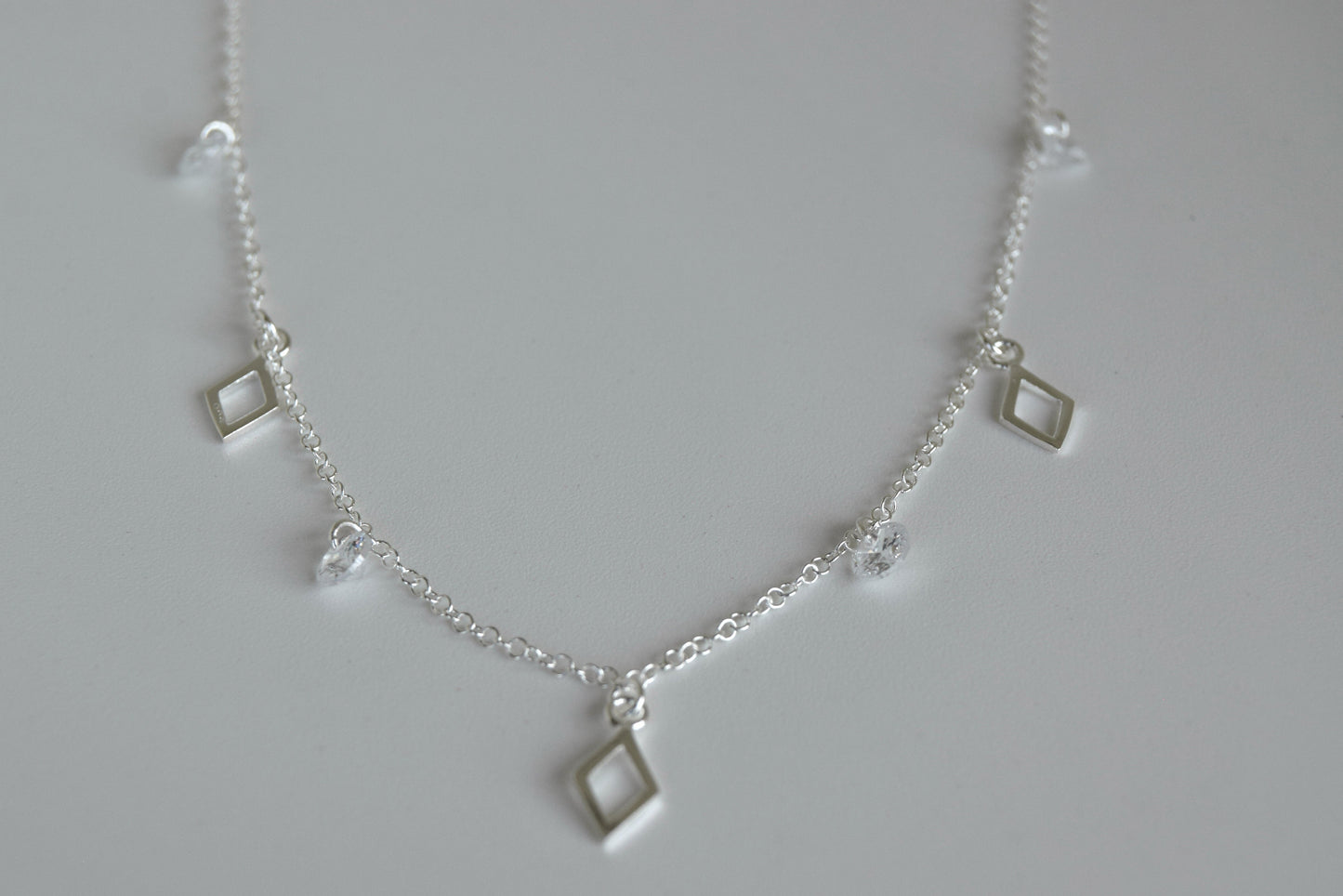 Sterling Silver Multi Open Diamond Shape Pendant And CZ Necklace