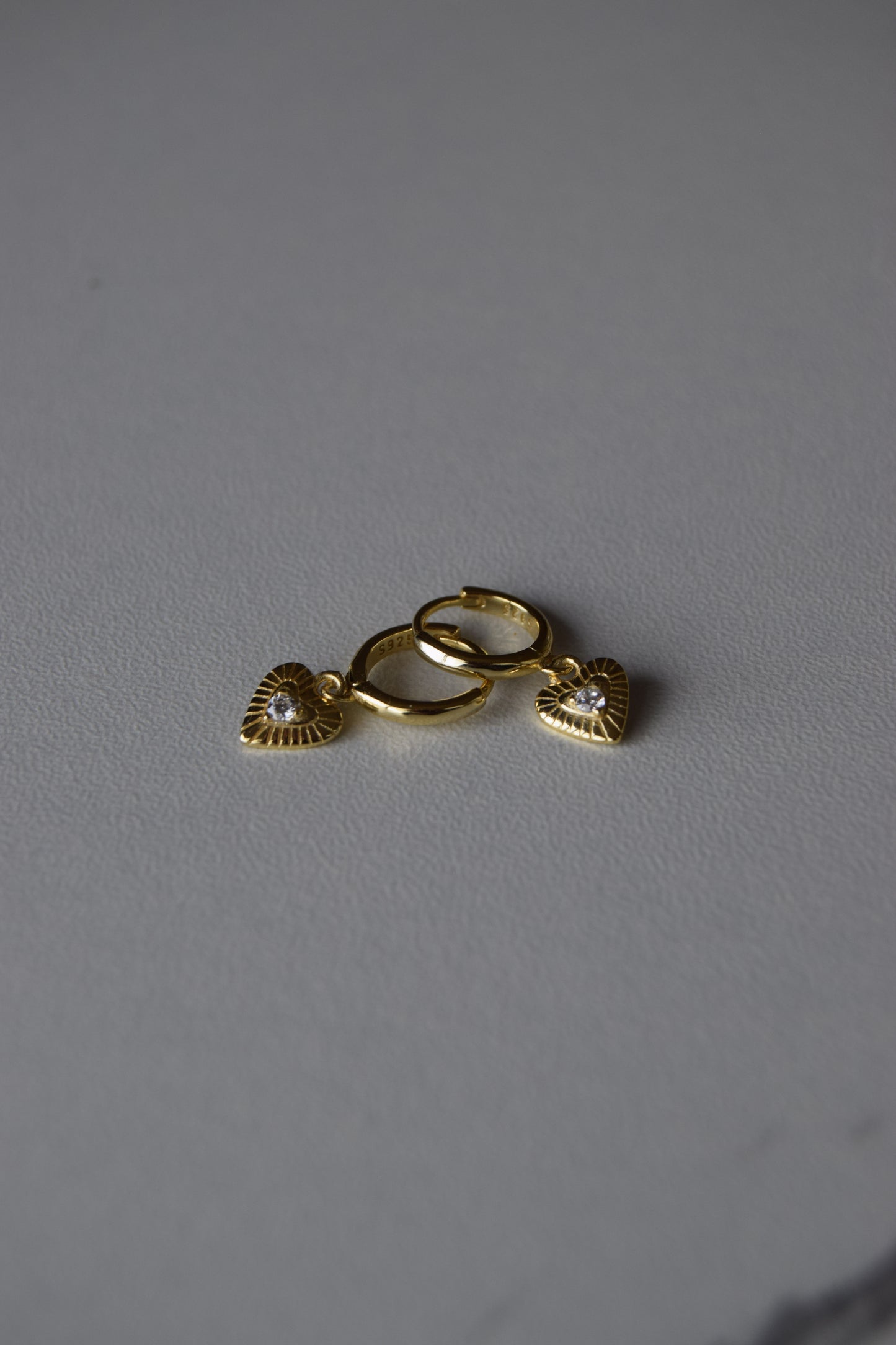 Gold Plated Huggies Earrings With Textured Heart Pendants